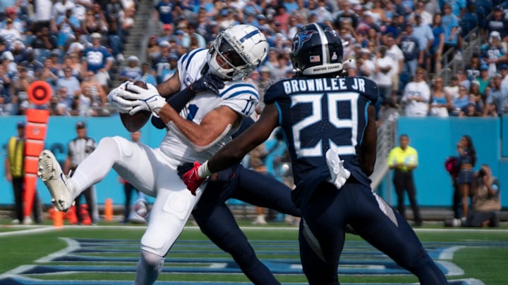 Indianapolis Colts wide receiver Michael Pittman Jr. (11) pulls down a touchdown pass while guarded by Tennessee Titans cornerback L'Jarius Sneed (38) and ornerback Jarvis Brownlee Jr. (29) during the fourth quarter of their game at Nissan Stadium in Nashville, Tenn., Sunday, Oct. 13, 2024. The score proved the be the winning touchdown with a final of Indianapolis 20 and Tennessee 17.
