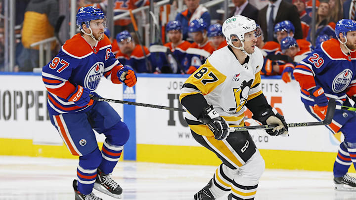 Mar 3, 2024; Edmonton, Alberta, CAN; Pittsburgh Penguins forward Sidney Crosby (87) and Edmonton Oilers forward Connor McDavid (97) follow the play during the third period at Rogers Place. Mandatory Credit: Perry Nelson-Imagn Images
