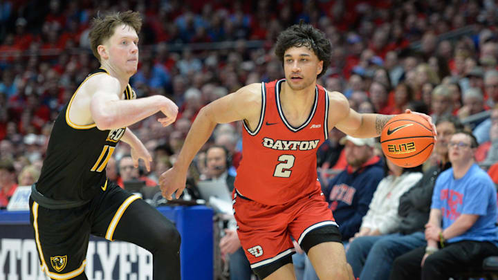 Mar 8, 2024; Dayton, Ohio, USA; Dayton Flyers forward Nate Santos (2) battles against Virginia Commonwealth Rams guard Max Shulga (11) during the second half of the game at University of Dayton Arena. Mandatory Credit: Matt Lunsford-USA TODAY Sports