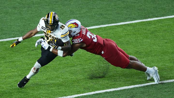 Kansas Jayhawks defensive end Leroy Harris III (33) makes a tackle on Missouri Tigers running back Jamal Roberts (20) during the game inside David Booth Kansas Memorial Stadium on Sept. 11, 2026. Kansas Jayhawks defensive end Leroy Harris III (33) makes a tackle on Missouri Tigers running back Jamal Roberts (20) during the game inside David Booth Kansas Memorial Stadium on Sept. 11, 2026.