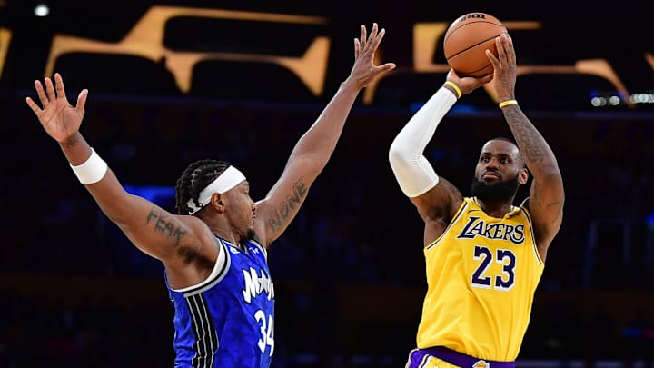 Oct 30, 2023; Los Angeles, California, USA; Los Angeles Lakers forward LeBron James (23) shoots against Orlando Magic center Wendell Carter Jr. (34) during the second half at Crypto.com Arena. Mandatory Credit: Gary A. Vasquez-Imagn Images