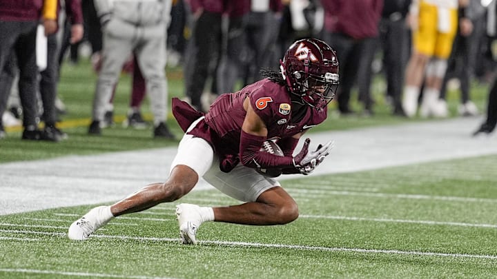 Jan 3, 2025; Charlotte, NC, USA;  Virginia Tech Hokies wide receiver Keylen Adams (6) makes a catch against the Minnesota Golden Gophers during the second quarter at the Duke’s Mayo Bowl at Bank of America Stadium. Mandatory Credit: Jim Dedmon-Imagn Images