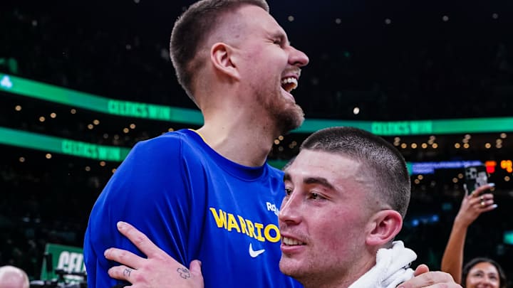 Mar 18, 2026; Boston, Massachusetts, USA; Boston Celtics guard Payton Pritchard (11) talks with Golden State Warriors center Kristaps Porzingis (7) after the game at TD Garden. Mandatory Credit: David Butler II-Imagn Images