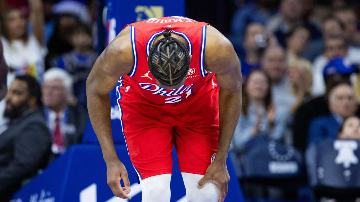 Apr 12, 2024; Philadelphia, Pennsylvania, USA; Philadelphia 76ers center Joel Embiid (21) clutches Apr 12, 2024; Philadelphia, Pennsylvania, USA; Philadelphia 76ers center Joel Embiid (21) clutches