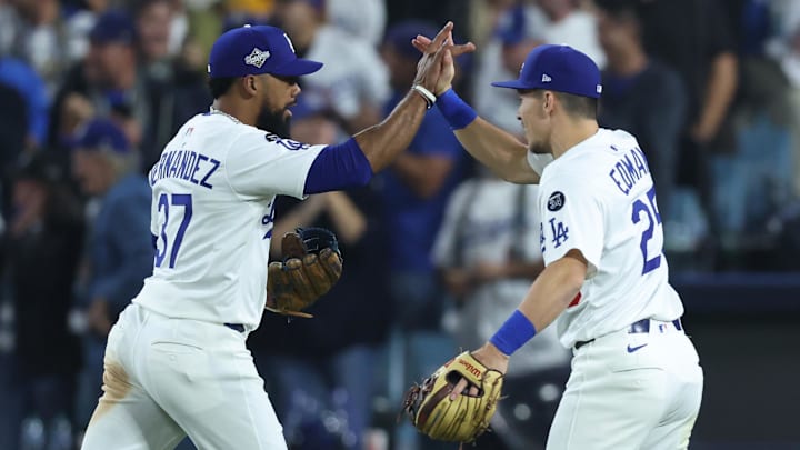 Oct 27, 2025; Los Angeles, California, USA; Los Angeles Dodgers right fielder Teoscar Hernandez (37) celebrates with second baseman Tommy Edman (25) after the tenth inning against the Toronto Blue Jays in game three of the 2025 MLB World Series at Dodger Stadium. Mandatory Credit: Kiyoshi Mio-Imagn Images Oct 27, 2025; Los Angeles, California, USA; Los Angeles Dodgers right fielder Teoscar Hernandez (37) celebrates with second baseman Tommy Edman (25) after the tenth inning against the Toronto Blue Jays in game three of the 2025 MLB World Series at Dodger Stadium. Mandatory Credit: Kiyoshi Mio-Imagn Images
