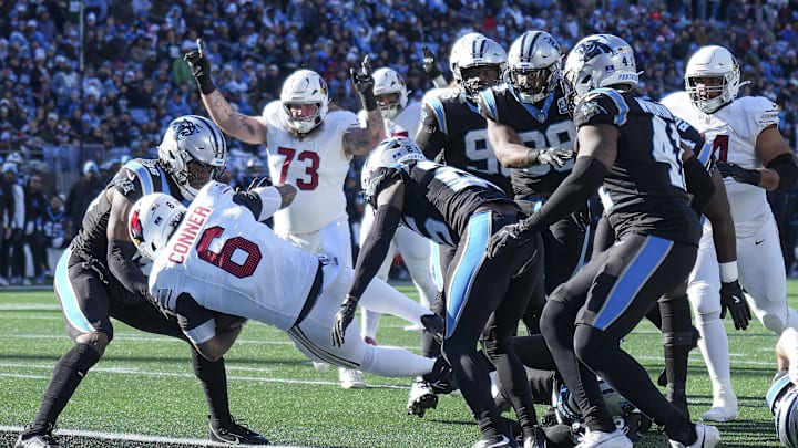 Dec 22, 2024; Charlotte, North Carolina, USA;  Arizona Cardinals running back James Conner (6) runs for a touchdown score against the Carolina Panthers during the second quarter at Bank of America Stadium. Mandatory Credit: Jim Dedmon-Imagn Images