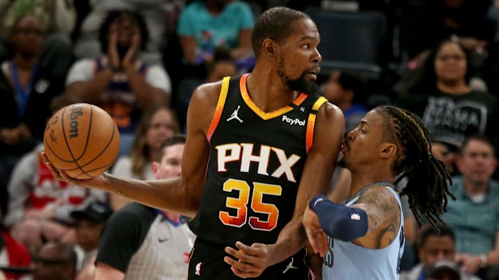 Mar 10, 2025; Memphis, Tennessee, USA; Phoenix Suns forward Kevin Durant (35) handles the ball as Memphis Grizzlies guard Ja Morant (12) defends during the first quarter at FedExForum. Mandatory Credit: Petre Thomas-Imagn Images Mar 10, 2025; Memphis, Tennessee, USA; Phoenix Suns forward Kevin Durant (35) handles the ball as Memphis Grizzlies guard Ja Morant (12) defends during the first quarter at FedExForum. Mandatory Credit: Petre Thomas-Imagn Images