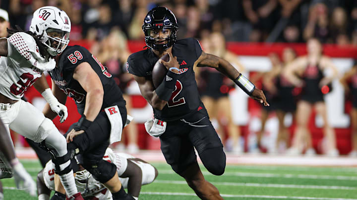 Sep 9, 2023; Piscataway, New Jersey, USA; Rutgers Scarlet Knights quarterback Gavin Wimsatt (2) carries the ball as Temple Owls linebacker Tra Thomas (30) pursues during the first half at SHI Stadium. Sep 9, 2023; Piscataway, New Jersey, USA; Rutgers Scarlet Knights quarterback Gavin Wimsatt (2) carries the ball as Temple Owls linebacker Tra Thomas (30) pursues during the first half at SHI Stadium.