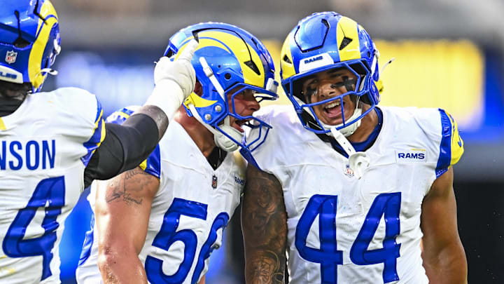 Aug 16, 2025; Inglewood, California, USA; Los Angeles Rams linebacker Shaun Dolac (56) and linebacker Brennan Jackson (44) react after blocking a pass against the Los Angeles Chargers during the second quarter at SoFi Stadium. Mandatory Credit: Jonathan Hui-Imagn Images