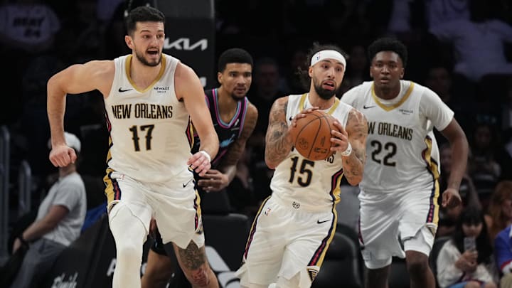 Jan 4, 2026; Miami, Florida, USA; New Orleans Pelicans guard Jose Alvarado (15) grabs a rebound on a missed shot by Miami Heat center Kel'el Ware (7) during the second half at Kaseya Center. Mandatory Credit: Jim Rassol-Imagn Images Jan 4, 2026; Miami, Florida, USA; New Orleans Pelicans guard Jose Alvarado (15) grabs a rebound on a missed shot by Miami Heat center Kel'el Ware (7) during the second half at Kaseya Center. Mandatory Credit: Jim Rassol-Imagn Images