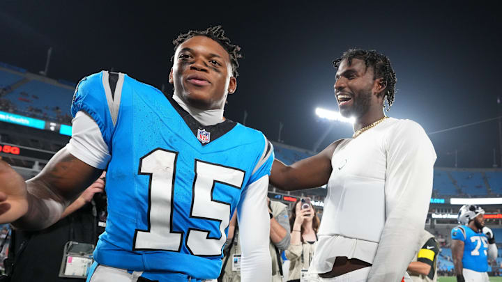 Aug 8, 2025; Charlotte, North Carolina, USA; Cleveland Browns quarterback Shedeur Sanders (12) with Carolina Panthers wide receiver Jimmy Horn Jr. (15) after the game at Bank of America Stadium. 