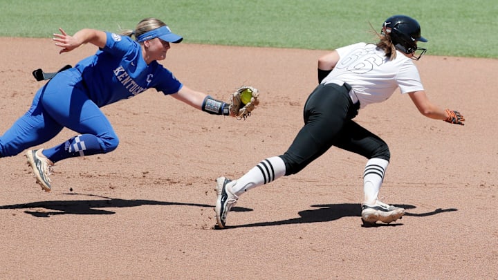 Oklahoma State catcher Caroline Wang (66) runs back to second base in front of Kentucky infielder Erin Coffel (21) during a softball game between the Oklahoma State Cowgirls and Kentucky in the Stillwater Regional of the NCAA Tournament, Saturday, May 18, 2024. Oklahoma State won 6-2.