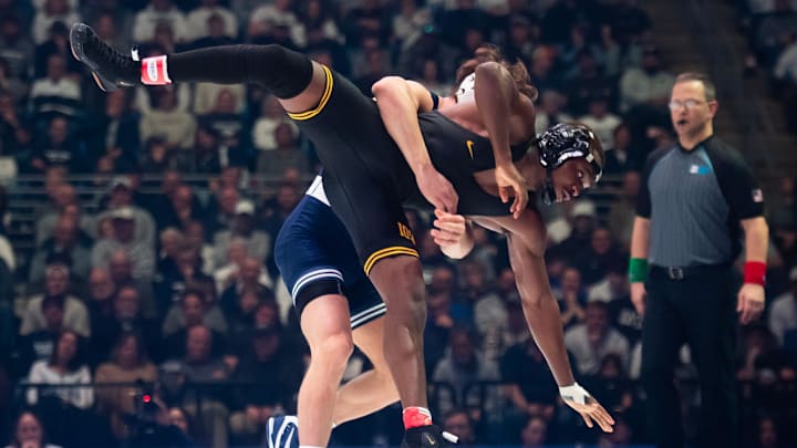 Penn State's Tyler Kasak takes down Iowa's Jacori Teemer in the 157-pound bout of their Big Ten wrestling match at the Bryce Jordan Center. 
