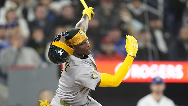 Athletics center fielder Denzel Clarke loses his helmet as he swings and misses on a pitch from Toronto Blue Jays starter Eric Lauer on Sunday. Athletics center fielder Denzel Clarke loses his helmet as he swings and misses on a pitch from Toronto Blue Jays starter Eric Lauer on Sunday.