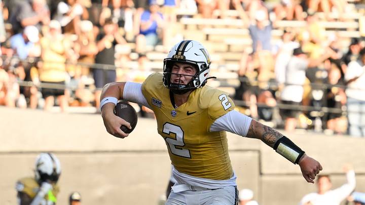 Sep 12, 2026; Nashville, Tennessee, USA;  Vanderbilt Commodores quarterback Jared Curtis (2) celebrates his touchdown against the Delaware Blue Hens during the second half at FirstBank Stadium. Mandatory Credit: Steve Roberts-Imagn Images