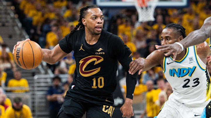 May 9, 2025; Indianapolis, Indiana, USA; Cleveland Cavaliers guard Darius Garland (10) dribbles the ball while Indiana Pacers forward Aaron Nesmith (23) defends during game three of the second round for the 2025 NBA Playoffs at Gainbridge Fieldhouse. Mandatory Credit: Trevor Ruszkowski-Imagn Images
