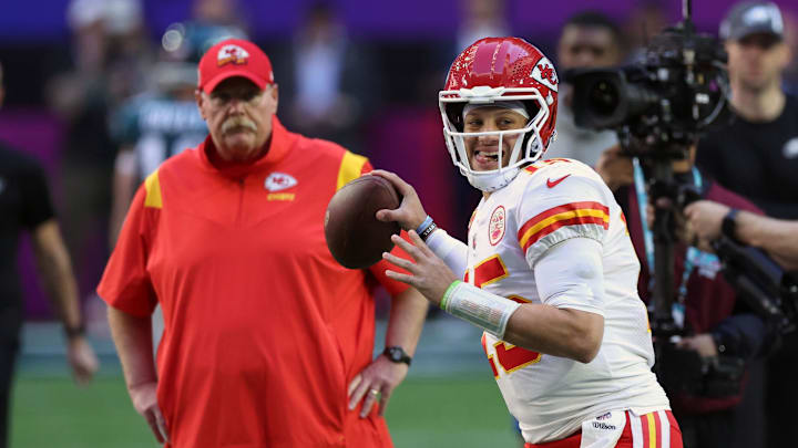 Feb 12, 2023; Glendale, Arizona, US; Kansas City Chiefs head coach Andy Reid watches quarterback Patrick Mahomes (15) warm up before Super Bowl LVII against the Philadelphia Eagles at State Farm Stadium. Mandatory Credit: Bill Streicher-Imagn Images