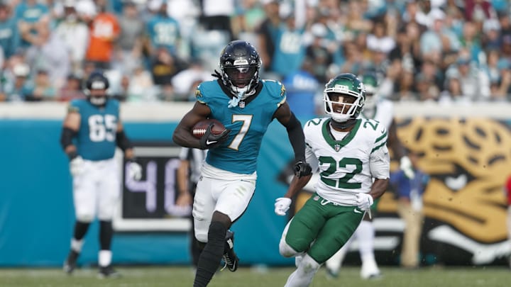 Dec 15, 2024; Jacksonville, Florida, USA; Jacksonville Jaguars wide receiver Brian Thomas Jr. (7) runs past New York Jets safety Tony Adams (22) during the third quarter at EverBank Stadium. Mandatory Credit: Morgan Tencza-Imagn Images