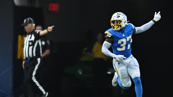 Aug 10, 2024; Inglewood, California, USA; Los Angeles Chargers safety Tony Jefferson (37) scores a touchdown against the Seattle Seahawks during the third quarter at SoFi Stadium. Mandatory Credit: Jonathan Hui-Imagn Images