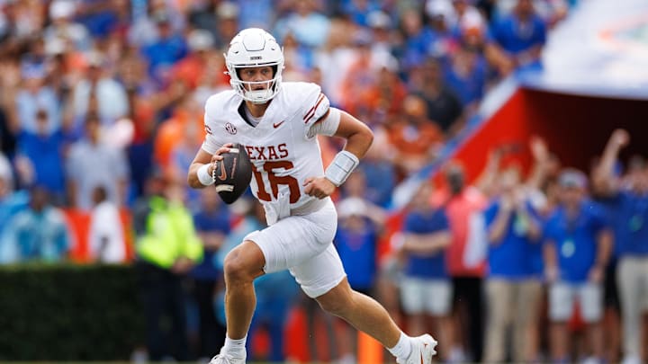Oct 4, 2025; Gainesville, Florida, USA; Texas Longhorns quarterback Arch Manning (16) scrambles with the ball against the Florida Gators during the first half at Ben Hill Griffin Stadium. Mandatory Credit: Matt Pendleton-Imagn Images