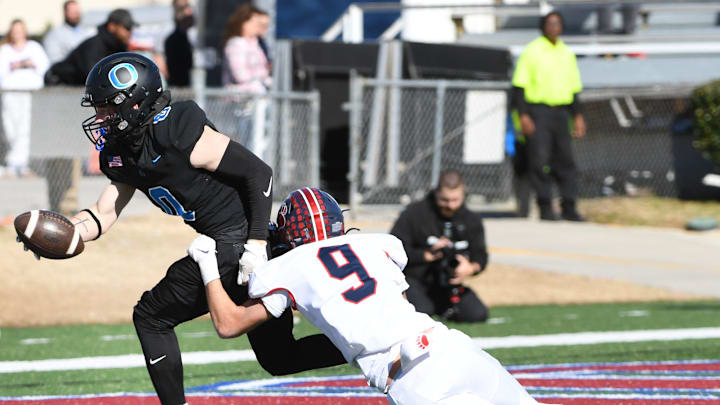 Belton-Honea Path (13-1) vs. Oceanside Collegiate (10-3) for the AAA high school football championships. The game was played at South Carolina State's Oliver C. Dawson Stadium in Orangeburg on Dec. 14, 2024.  Oceanside Collegiate Academy Peyton Shaw (0) makes it in the end zone as Belton-Honea Path High senior Colby Bates (9) tries to stop him.