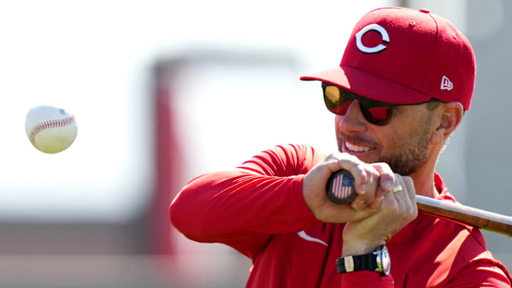 Cincinnati Reds bench coach Jeff Pickler hits ground balls to pitchers during fielding drills,, Sunday, Feb. 18, 2024, at the team's spring training facility in Goodyear, Ariz.