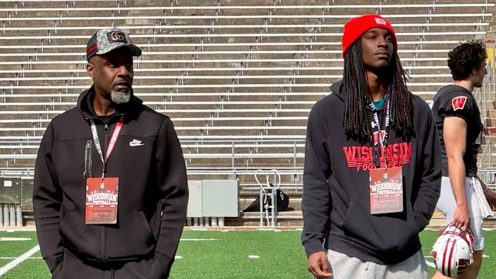 Wisconsin football 2026 safety target Messiah Tilson, right, attended the Badgers' final spring practice April 24.