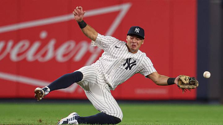 Aug 8, 2025; Bronx, New York, USA; New York Yankees shortstop Anthony Volpe (11) can not secure the ball on a single by Houston Astros catcher Yainer Diaz (not pictured) during the sixth inning at Yankee Stadium. Mandatory Credit: Vincent Carchietta-Imagn Images