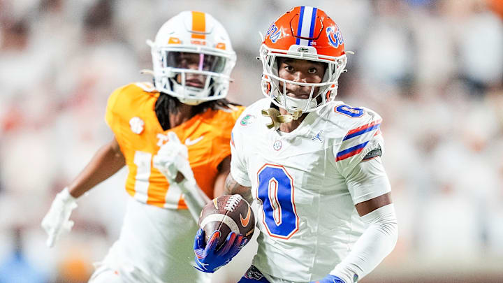 Oct 12, 2024; Knoxville, Tennessee, USA; Florida Gators defensive back Sharif Denson (0) runs with the ball after intercepting a pass by Tennessee Volunteers quarterback Nico Iamaleava at Neyland Stadium. Mandatory Credit: Brianna Paciorka/USA TODAY Network via Imagn Images