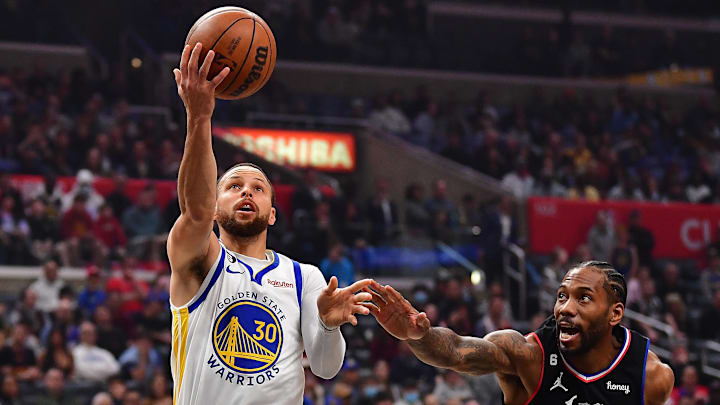Golden State Warriors guard Stephen Curry (30) moves to the basket against Los Angeles Clippers forward Kawhi Leonard (2) during the first half at Crypto.com Arena. Mandatory Credit: Gary A. Vasquez-Imagn Images