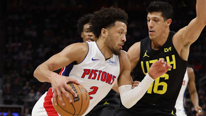 Dec 21, 2023; Detroit, Michigan, USA;  Detroit Pistons guard Cade Cunningham (2) dribbles defended by Simone Fontecchio
