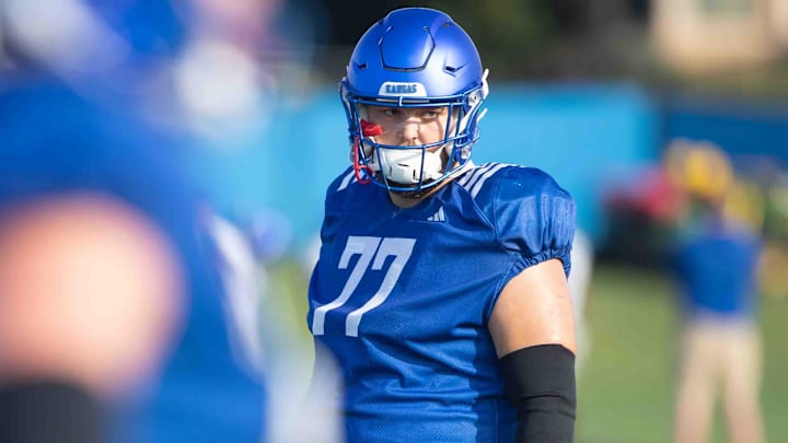 Kansas senior offensive lineman Bryce Cabeldue lines up during a drill at practice.