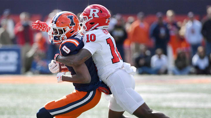 Nov 1, 2025; Champaign, Illinois, USA;  Illinois Fighting Illini wide receiver Justin Bowick (0) is tackled by Rutgers Scarlet Knights defensive back Jacobie Henderson (10) during the first half at Memorial Stadium. Mandatory Credit: Ron Johnson-Imagn Images