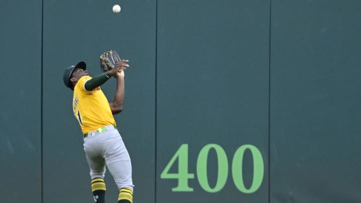 Jul 19, 2025; Cleveland, Ohio, USA; Athletics center fielder Denzel Clarke (1) makes a catch in the first inning against the Cleveland Guardians at Progressive Field. Mandatory Credit: David Richard-Imagn Images
