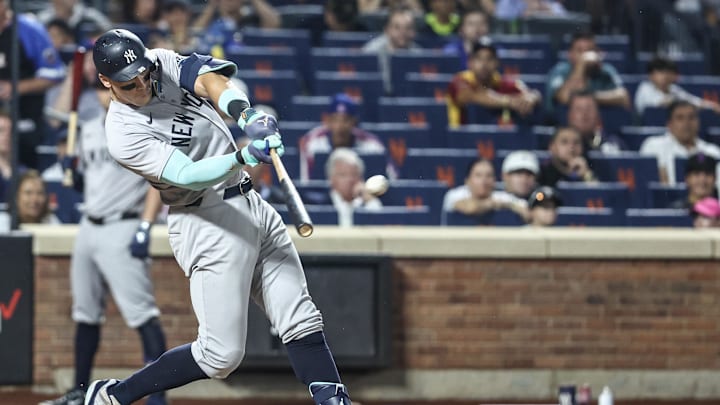Jun 26, 2024; New York City, New York, USA;  New York Yankees center fielder Aaron Judge (99) hits a two run home run in the sixth inning against the New York Mets at Citi Field. Mandatory Credit: Wendell Cruz-USA TODAY Sports