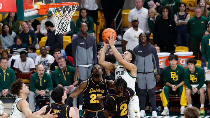 Feb 21, 2026; Waco, Texas, USA; Baylor Bears guard Isaac Williams (10) scores a basket over Arizona State Sun Devils guard Anthony Johnson (2) during the second half at Paul and Alejandra Foster Pavilion. Mandatory Credit: Chris Jones-Imagn Images Feb 21, 2026; Waco, Texas, USA; Baylor Bears guard Isaac Williams (10) scores a basket over Arizona State Sun Devils guard Anthony Johnson (2) during the second half at Paul and Alejandra Foster Pavilion. Mandatory Credit: Chris Jones-Imagn Images