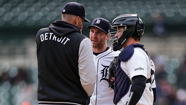Detroit Tigers pitching coach Chris Fetter (41), left, talk sot pitcher John Brebbia (49), center, and catcher Dillon Dingler (13) during the ninth inning against New York Yankees at Comerica Park in Detroit on Wednesday, April 9, 2025.