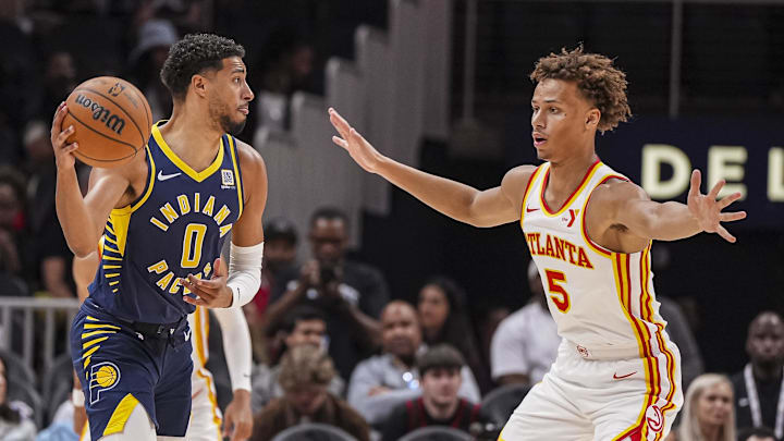 Oct 8, 2024; Atlanta, Georgia, USA; Indiana Pacers guard Tyrese Haliburton (0) is guarded by Atlanta Hawks guard Dyson Daniels (5) during the first half at State Farm Arena. Mandatory Credit: Dale Zanine-Imagn Images Oct 8, 2024; Atlanta, Georgia, USA; Indiana Pacers guard Tyrese Haliburton (0) is guarded by Atlanta Hawks guard Dyson Daniels (5) during the first half at State Farm Arena. Mandatory Credit: Dale Zanine-Imagn Images