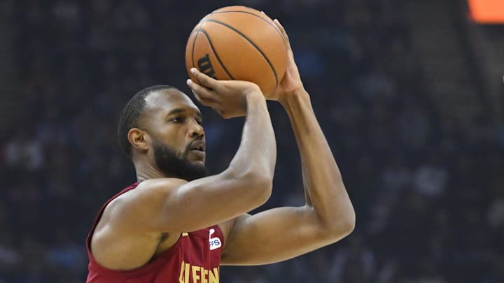 Jan 9, 2025; Cleveland, Ohio, USA; Cleveland Cavaliers forward Evan Mobley (4) shoots a three-point basket in the first quarter against the Toronto Raptors at Rocket Mortgage FieldHouse. Mandatory Credit: David Richard-Imagn Images
