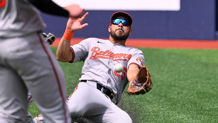 Baltimore Orioles right fielder Anthony Santander (25) fails to catch a bloop double hit by Toronto Blue Jays center fielder Daulton Varsho (not shown) in the fourth inning at Rogers Centre on June 6, 2024.