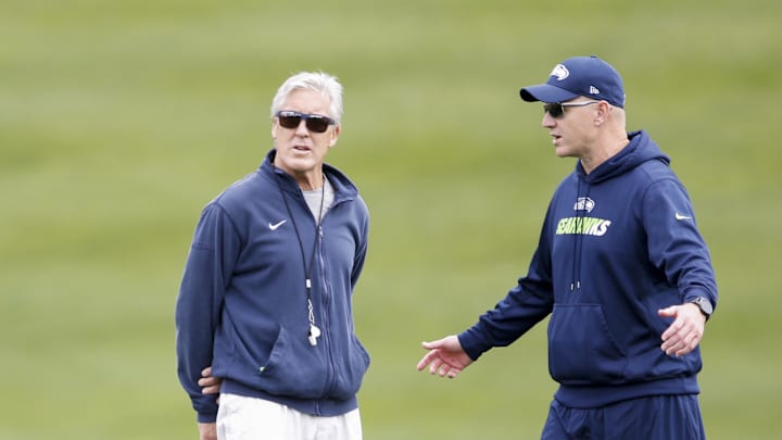 Jun 13, 2017; Renton, WA, USA; Seattle Seahawks offensive coordinator Darrell Bevell talks with head coach Pete Carroll during a minicamp practice at the Virginia Mason Athletic Center. Mandatory Credit: Joe Nicholson-Imagn Images