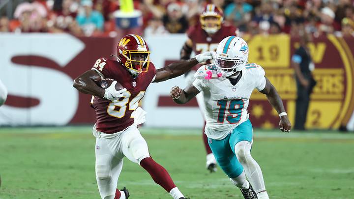 Aug 14, 2026; Landover, Maryland, USA; Washington Commanders wide receiver Jacoby Jones (84) runs with the ball as Miami Dolphins linebacker Kyle Louis (19) defends during the second half at Northwest Stadium. Mandatory Credit: Amber Searls-Imagn Images Aug 14, 2026; Landover, Maryland, USA; Washington Commanders wide receiver Jacoby Jones (84) runs with the ball as Miami Dolphins linebacker Kyle Louis (19) defends during the second half at Northwest Stadium. Mandatory Credit: Amber Searls-Imagn Images