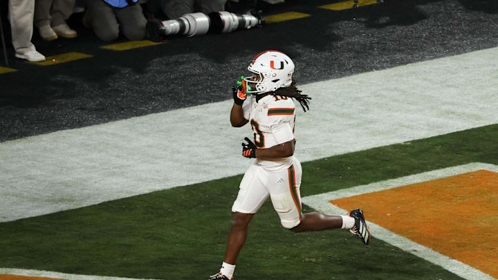Jan 19, 2026; Miami Gardens, FL, USA; Miami Hurricanes wide receiver Malachi Toney (10) celebrates after scoring a touchdown against the Indiana Hoosiers in the fourth quarter during the College Football Playoff National Championship game at Hard Rock Stadium. Mandatory Credit: Kim Klement Neitzel-Imagn Images