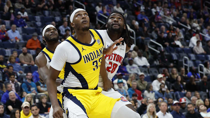 Oct 23, 2024; Detroit, Michigan, USA;  Indiana Pacers center Myles Turner (33) and Detroit Pistons center Isaiah Stewart (28) look for the rebound in the first half at Little Caesars Arena. Mandatory Credit: Rick Osentoski-Imagn Images