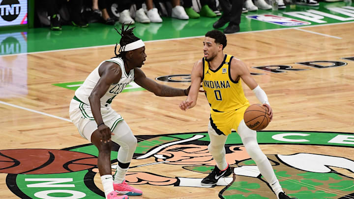 May 21, 2024; Boston, Massachusetts, USA; Indiana Pacers guard Tyrese Haliburton (0) dribbles the ball against Boston Celtics guard Jrue Holiday (4) in overtime for game one of the eastern conference finals for the 2024 NBA playoffs at TD Garden. Mandatory Credit: Bob DeChiara-USA TODAY Sports May 21, 2024; Boston, Massachusetts, USA; Indiana Pacers guard Tyrese Haliburton (0) dribbles the ball against Boston Celtics guard Jrue Holiday (4) in overtime for game one of the eastern conference finals for the 2024 NBA playoffs at TD Garden. Mandatory Credit: Bob DeChiara-USA TODAY Sports