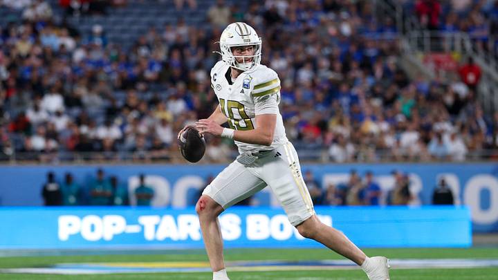 Dec 27, 2025; Orlando, FL, USA; Georgia Tech Yellow Jackets quarterback Haynes King (10) looks to pass against the BYU Cougars in the third quarter during the Pop-Tarts Bowl at Camping World Stadium. Mandatory Credit: Nathan Ray Seebeck-Imagn Images