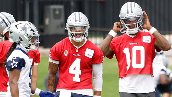 Jun 10, 2025; Arlington, TX, USA;  Dallas Cowboys quarterback Dak Prescott (4) reacts during a practice drill at the Ford Center at the Star Training Facility in Frisco, Texas. Mandatory Credit: Chris Jones-Imagn Images