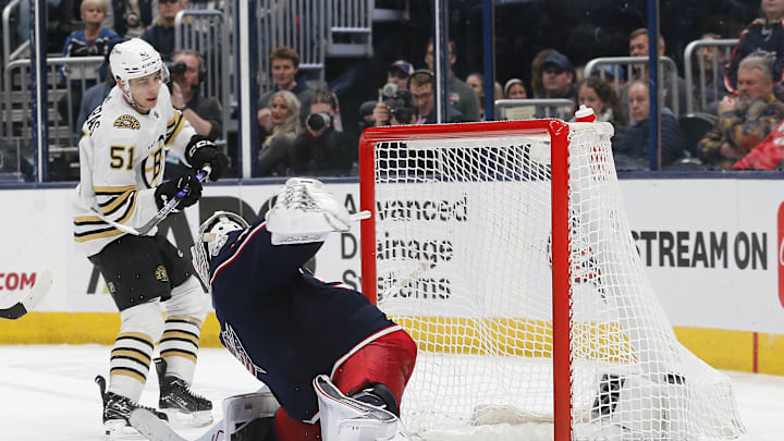 Nov 27, 2023; Columbus, Ohio, USA; Boston Bruins center Matthew Poitras (51) scores a goal on his shot past Columbus Blue Jackets goalie Spencer Martin (30) during the third period at Nationwide Arena. Mandatory Credit: Russell LaBounty-USA TODAY Sports
