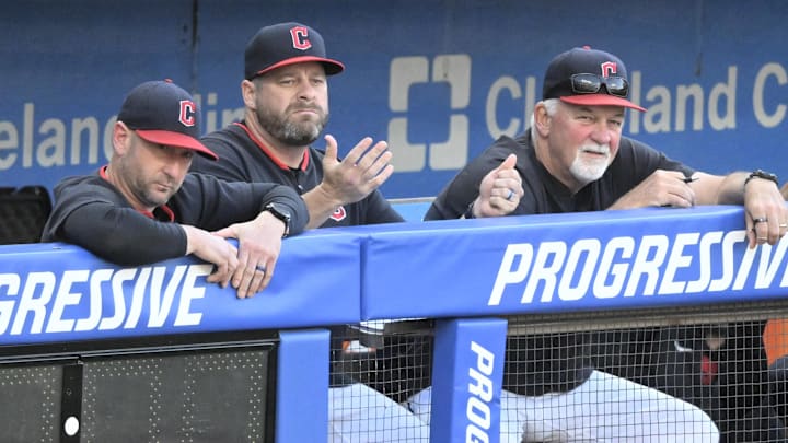 Jul 22, 2025; Cleveland, Ohio, USA; Cleveland Guardians associate manager Craig Albernaz (left), manager Stephen Vogt (center) and pitching coach Carl Willis (51) react after a foul ball entered the dugout in the third inning against the Baltimore Orioles at Progressive Field. Mandatory Credit: David Richard-Imagn Images
