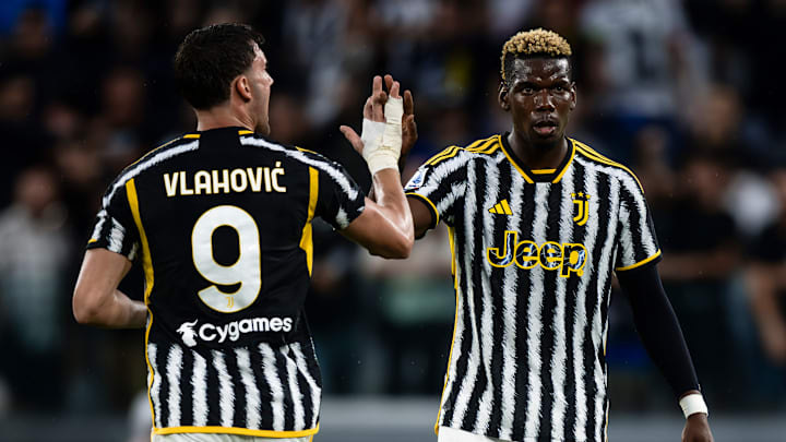 Dusan Vlahovic (L) of Juventus FC  high fives Paul Pogba of...